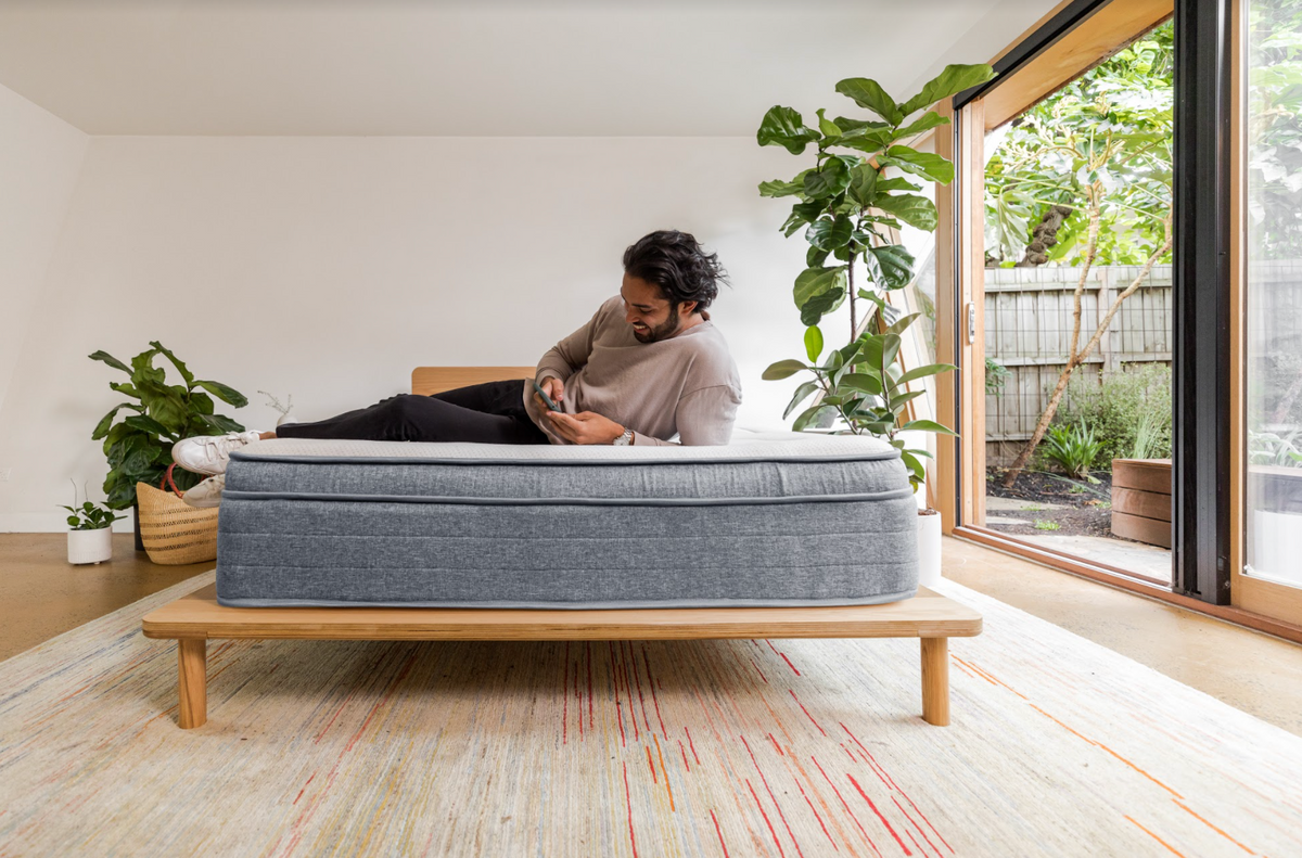 Man lying on hybrid bed 