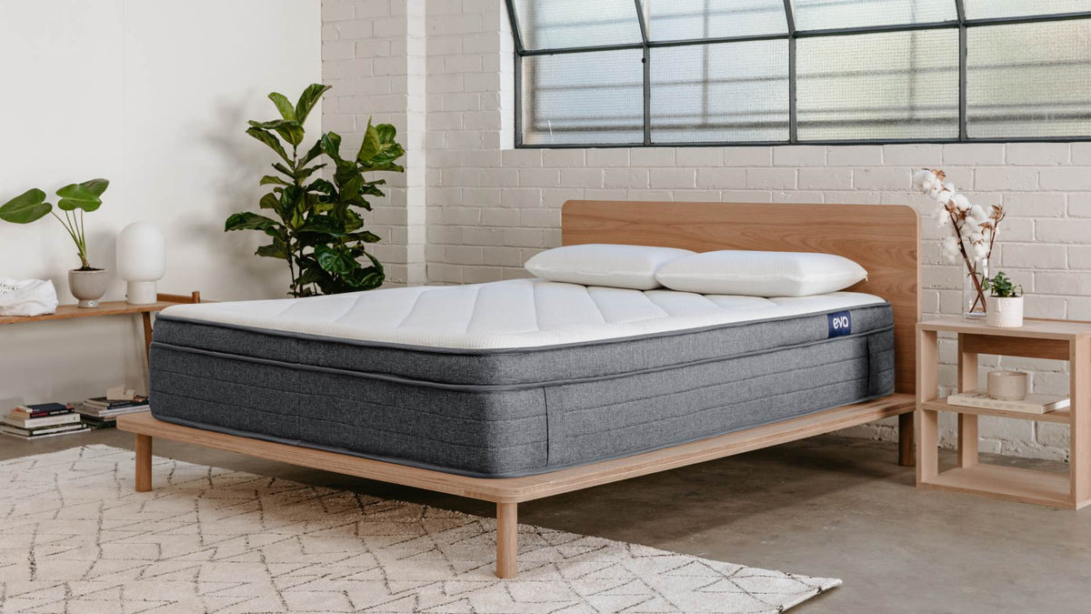 A bedroom with the Eva Mattress, Pillows and Bed Base.