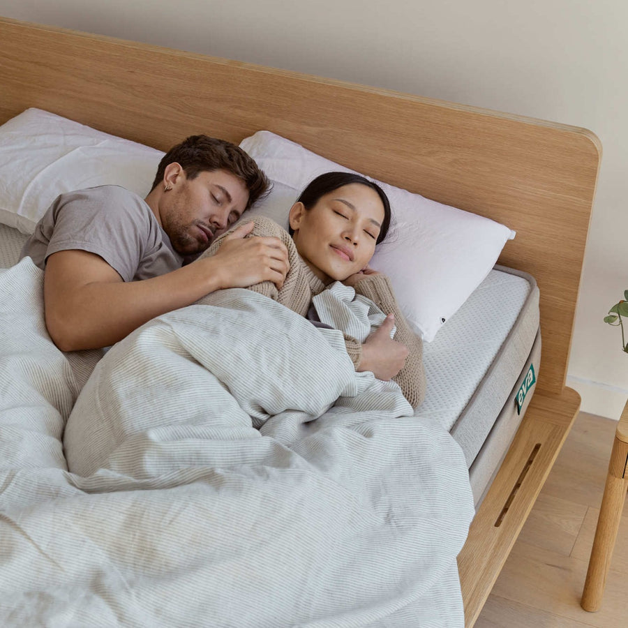 Couple having a relaxed sleep | {"option1":["Premium Adapt Mattress"]}